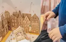 Dzieci oglądają rozkładane ilustracje w książce.
